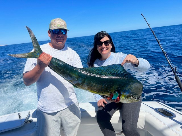 Couple with a bull dorado